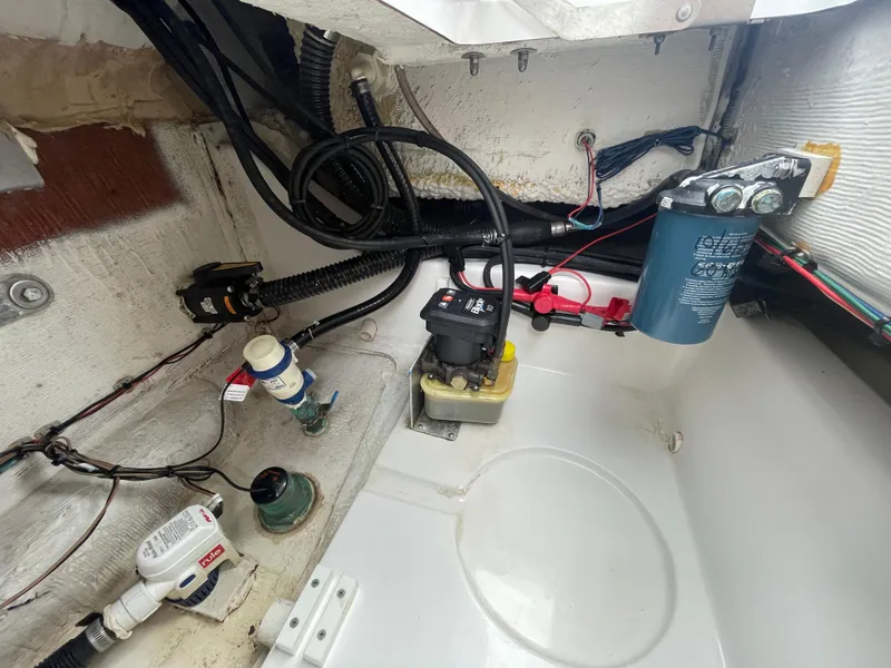 Slide: The Image of Interior view of a 2022 Sportsman Masters 247OE Bay Boat showing wiring and components. - 20