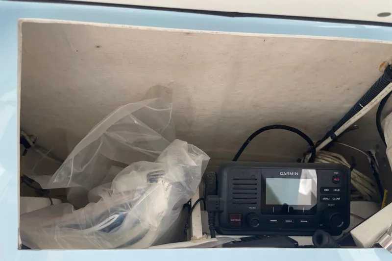 Slide: The Image of 2021 Pathfinder 2600 TRS boat compartment with Garmin marine radio and equipment. - 22