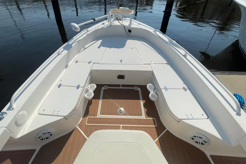 Slide: The Image of 2021 Pathfinder 2600 TRS boat interior with seating and storage compartments. - 7