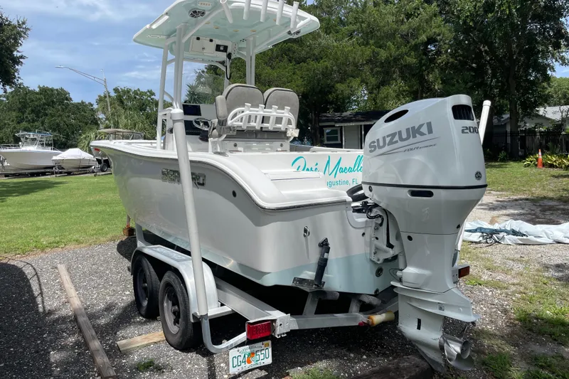 Slide: The Image of 2021 Sea Pro 219 Center Console boat with Suzuki 200 outboard engine on trailer. - 3