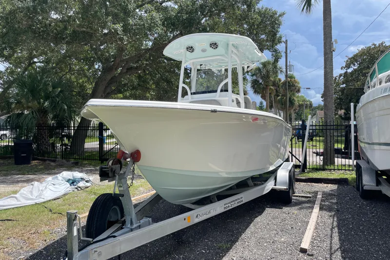 Slide: The Image of 2021 Sea Pro 219 Center Console boat on trailer, parked outdoors. - 4