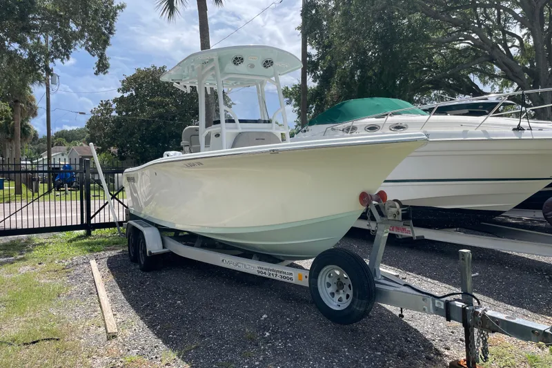 Slide: The Image of 2021 Sea Pro 219 Center Console boat on trailer, parked outdoors. - 5