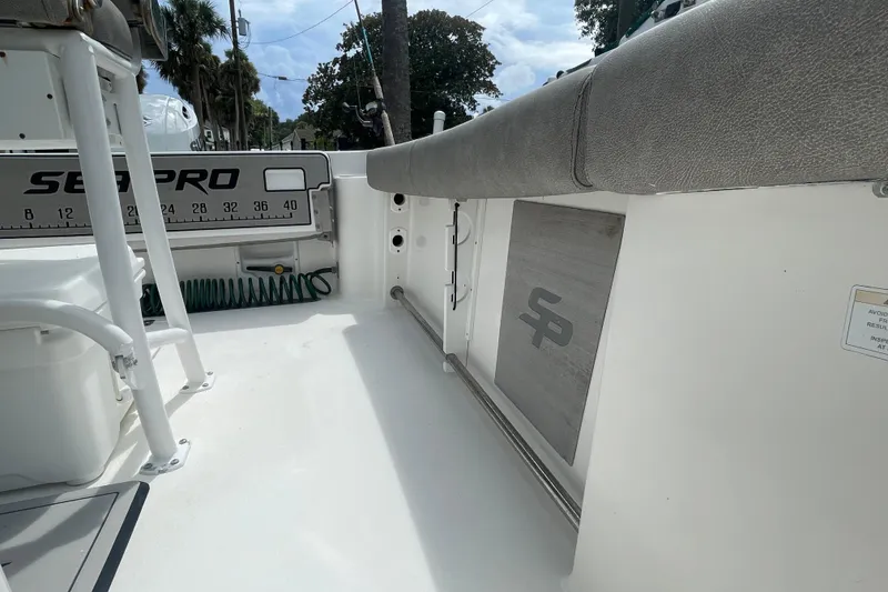 Slide: The Image of 2021 Sea Pro 219 Center Console boat interior with seating and storage features. - 7