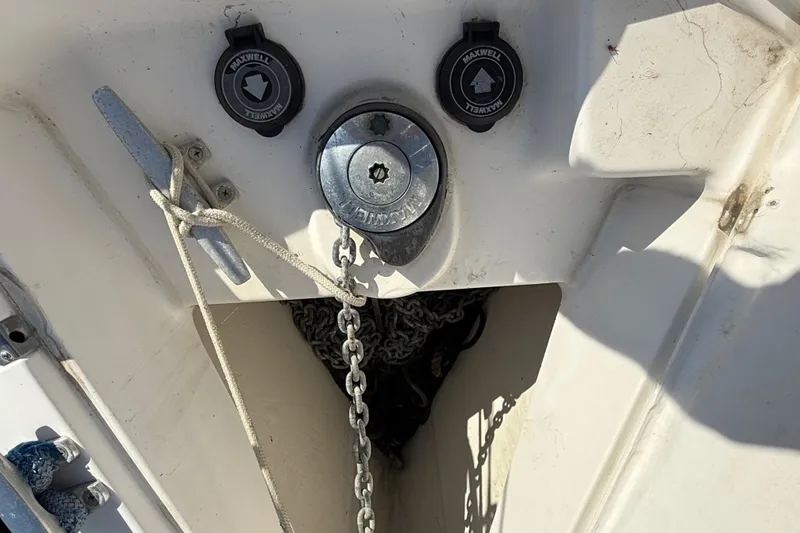 Slide: The Image of Anchor chain and winch on 1999 Hunter Passage 420 sailboat deck. - 11