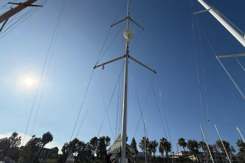 Slide: The Image of Sailboat mast of 1999 Hunter Passage 420 against clear blue sky. - 15