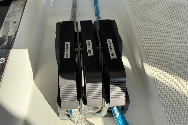 Slide: The Image of Close-up of rope clutches on a 1999 Hunter Passage 420 sailboat. - 19