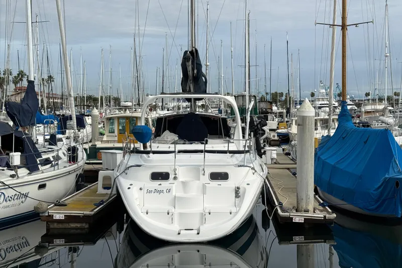 Slide: The Image of Hunter Passage 420 sailboat docked in San Diego marina, surrounded by other boats. - 3