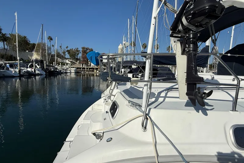 Slide: The Image of 1999 Hunter Passage 420 sailboat docked in a marina with clear blue skies. - 5