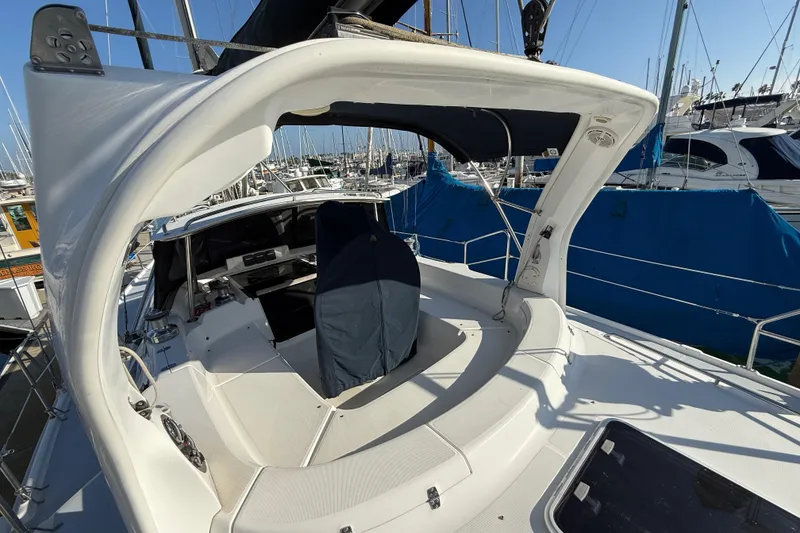 Slide: The Image of 1999 Hunter Passage 420 sailboat cockpit view in marina setting. - 6