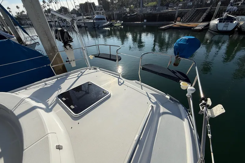 Slide: The Image of 1999 Hunter Passage 420 sailboat deck view in marina setting. - 8