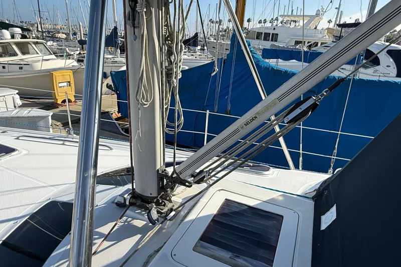 Slide: The Image of 1999 Hunter Passage 420 sailboat deck with rigging and marina background. - 9