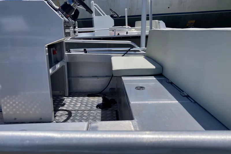 Slide: The Image of Interior of 2026 Gospel Boat Landing Craft, featuring seating and control panel. - 7