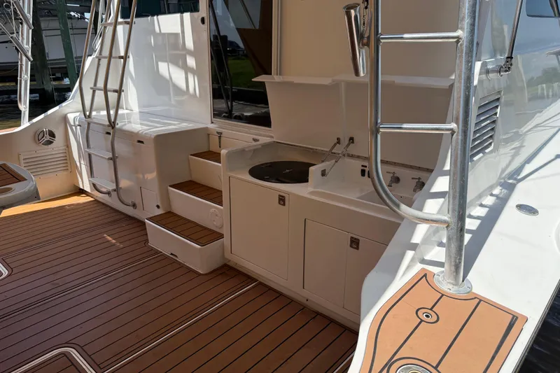 Slide: The Image of 1988 Cheoy Lee 58 Convertible yacht deck with outdoor sink and ladder. - 14