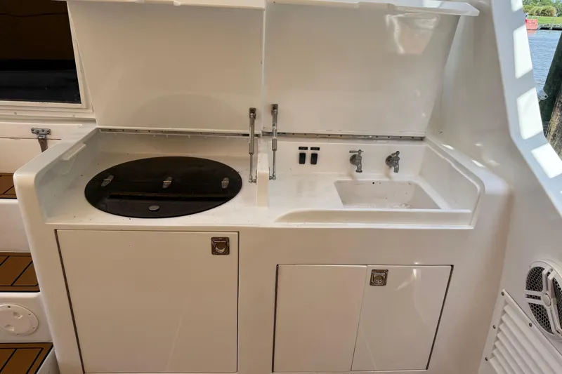 Slide: The Image of 1988 Cheoy Lee 58 Convertible yacht outdoor kitchen with sink and grill. - 16