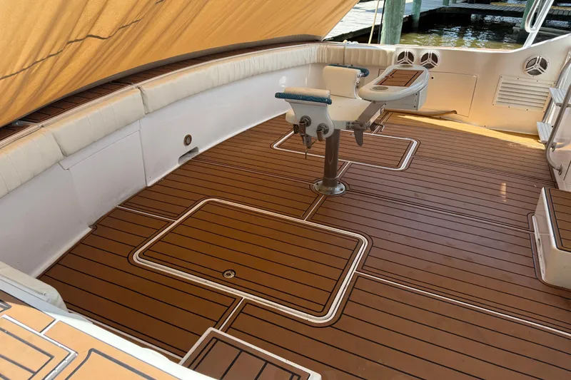 Slide: The Image of 1988 Cheoy Lee 58 Convertible yacht deck with teak flooring and fishing chair. - 17