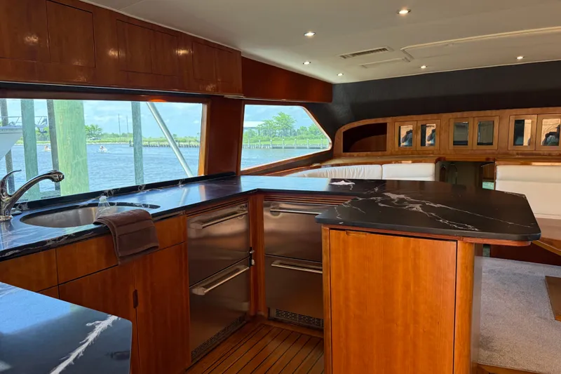 Slide: The Image of Luxurious interior of 1988 Cheoy Lee 58 Convertible yacht with elegant wood finishes. - 23