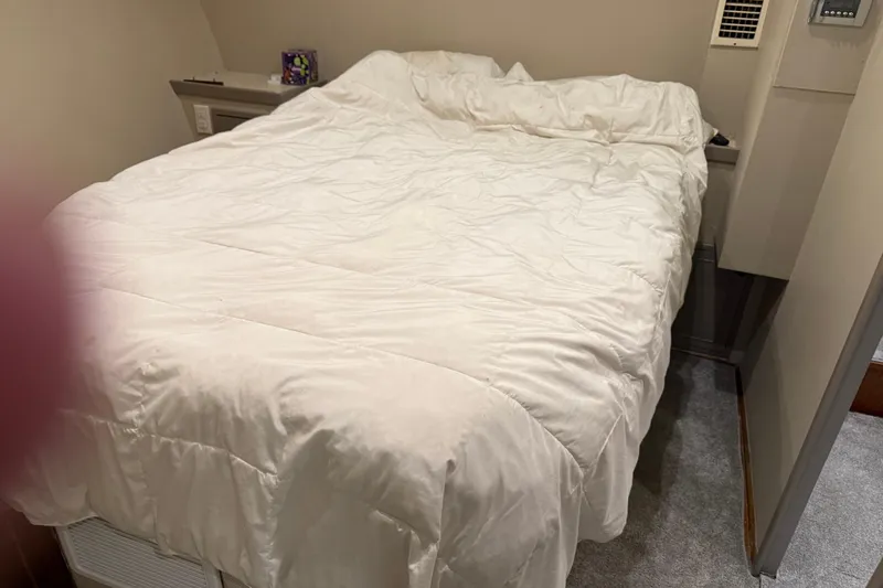 Slide: The Image of Cozy bedroom with white bedding on a 1988 Cheoy Lee 58 Convertible yacht. - 32