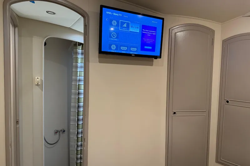 Slide: The Image of Interior of 1988 Cheoy Lee 58 Convertible yacht with TV and shower area. - 39