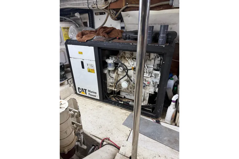 Slide: The Image of Engine room of 1988 Cheoy Lee 58 Convertible with CAT Marine Power generator. - 52