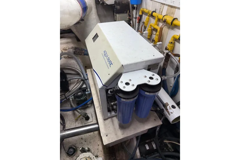 Slide: The Image of Aqua Matic water filtration system in 1988 Cheoy Lee 58 Convertible yacht engine room. - 61