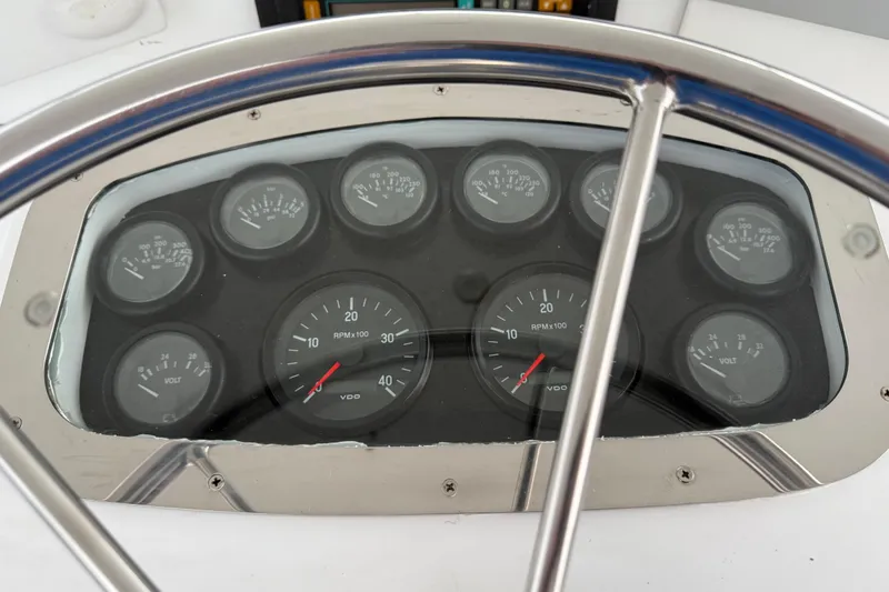 Slide: The Image of Dashboard of 1988 Cheoy Lee 58 Convertible yacht with gauges and steering wheel. - 75