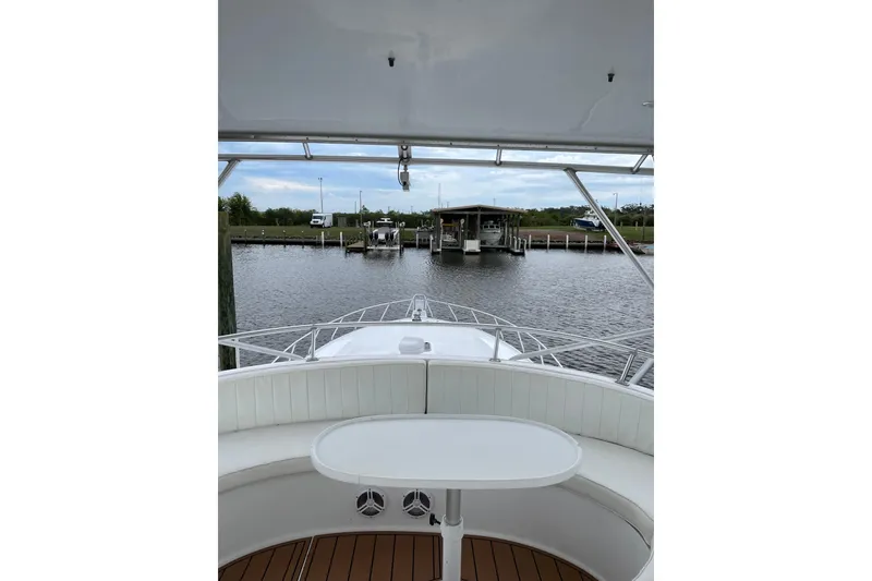 Slide: The Image of 1988 Cheoy Lee 58 Convertible yacht at dock, view from deck seating area. - 80