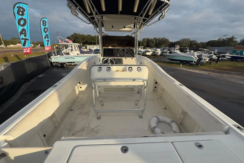 Slide: The Image of 2003 Hydra-Sports Vector 2600 CC boat hull on trailer under clear blue sky. - 12