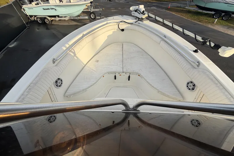 Slide: The Image of 2003 Hydra-Sports Vector 2600 CC boat at a sale event, showcasing helm and T-top. - 19