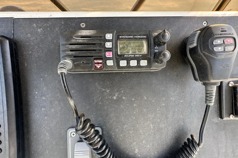 Slide: The Image of 2003 Hydra-Sports Vector 2600 CC boat ignition panel with safety warning and keys. - 29