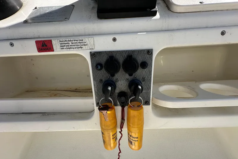 Slide: The Image of 2003 Hydra-Sports Vector 2600 CC boat dashboard with Yamaha controls and switches. - 31