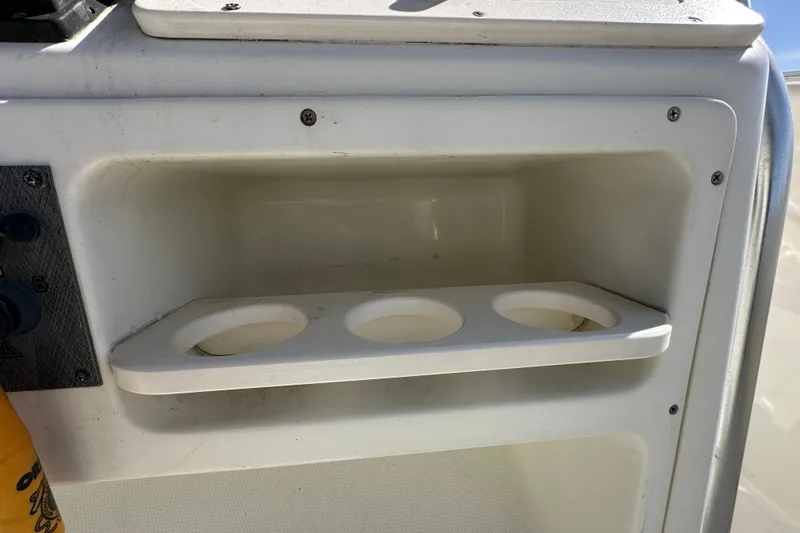 Slide: The Image of Control panel of a 2003 Hydra-Sports Vector 2600 CC boat with switches and gauges. - 32