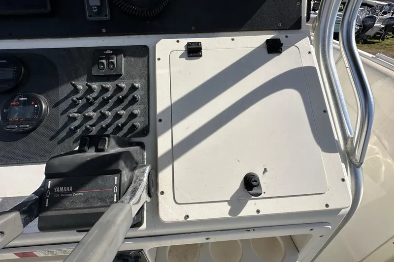 Slide: The Image of Steering wheel of 2003 Hydra-Sports Vector 2600 CC boat, featuring control panel and gauges. - 33