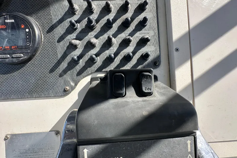 Slide: The Image of 2003 Hydra-Sports Vector 2600 CC boat deck with storage compartment and safety flares. - 34