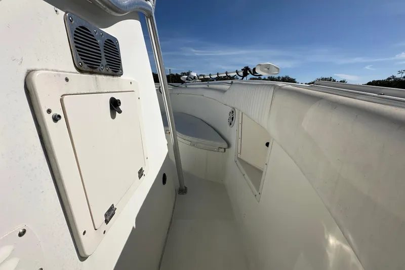 Slide: The Image of 2003 Hydra-Sports Vector 2600 CC boat interior with white cushioned seating and speakers. - 45