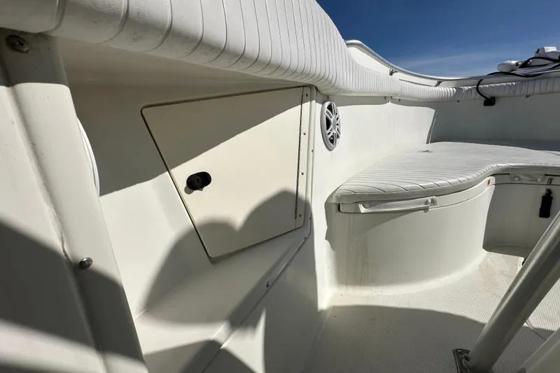 Slide: The Image of 2003 Hydra-Sports Vector 2600 CC boat interior with white cushioned seating. - 48