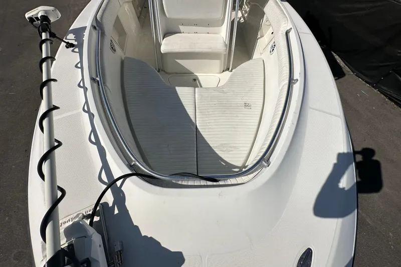 Slide: The Image of 2003 Hydra-Sports Vector 2600 CC boat interior with seating and console, parked outdoors. - 63