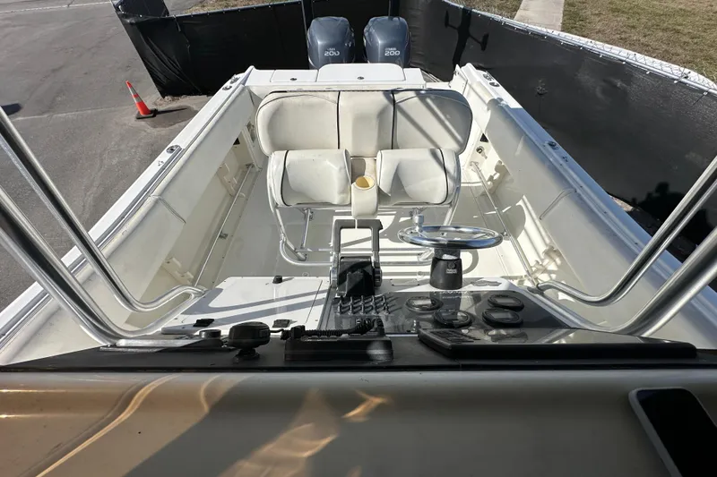 Slide: The Image of 2003 Hydra-Sports Vector 2600 CC boat interior with Yamaha 200 engines, featuring seating and storage. - 70