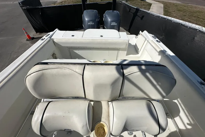 Slide: The Image of 2003 Hydra-Sports Vector 2600 CC boat interior with rod holders and seating. - 71