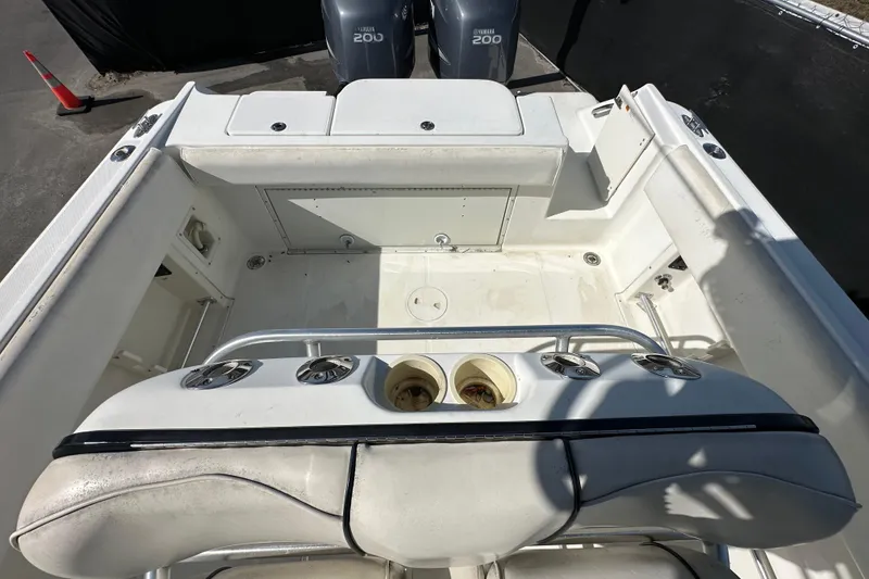 Slide: The Image of 2003 Hydra-Sports Vector 2600 CC boat interior with rod holders and seating. - 72