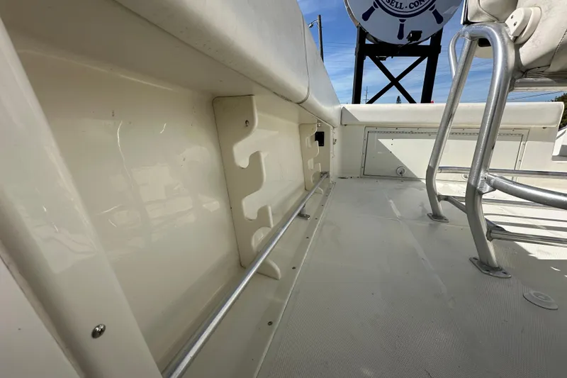 Slide: The Image of 2003 Hydra-Sports Vector 2600 CC boat detail showing a white compartment with a hose fitting. - 74