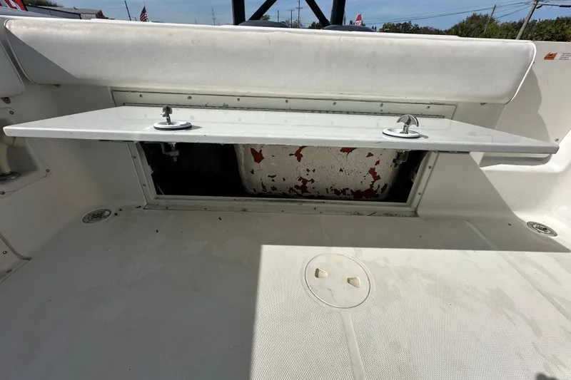 Slide: The Image of Open storage compartment on 2003 Hydra-Sports Vector 2600 CC boat deck. - 78