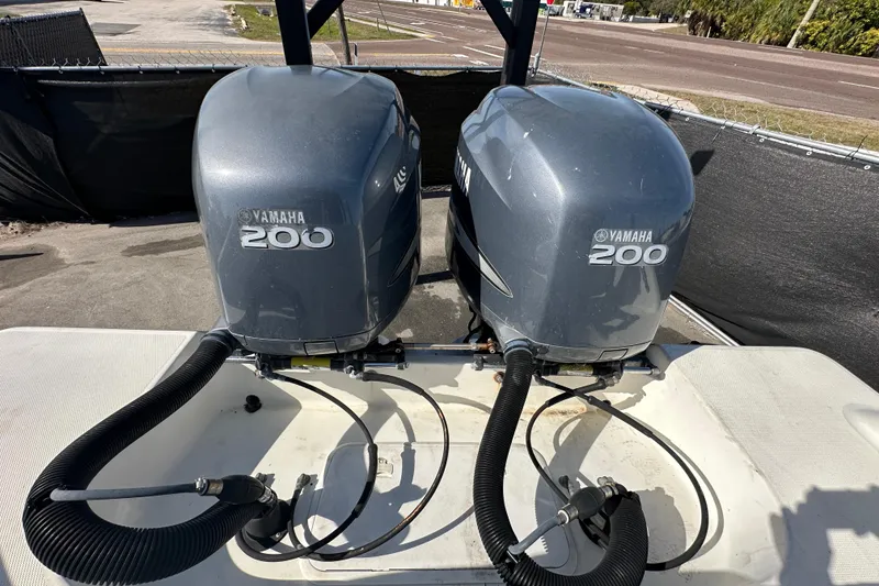 Slide: The Image of Trailer tire close-up with Hydra-Sports Vector 2600 CC boat in background, 2003 model. - 86