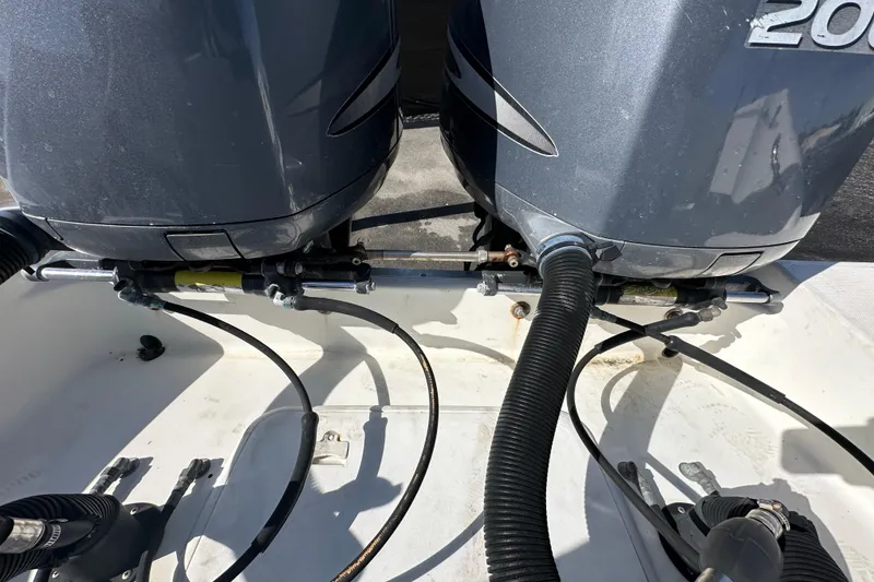 Slide: The Image of Three trailer wheels supporting a 2003 Hydra-Sports Vector 2600 CC boat. - 87