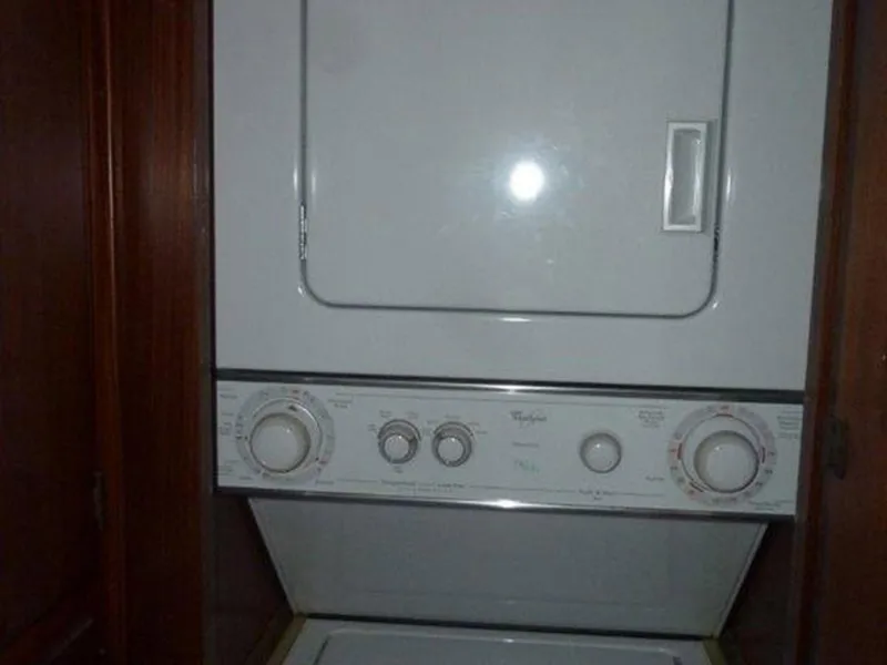 Slide: The Image of Stacked washer and dryer inside 1987 Hatteras Flybridge yacht. - 17