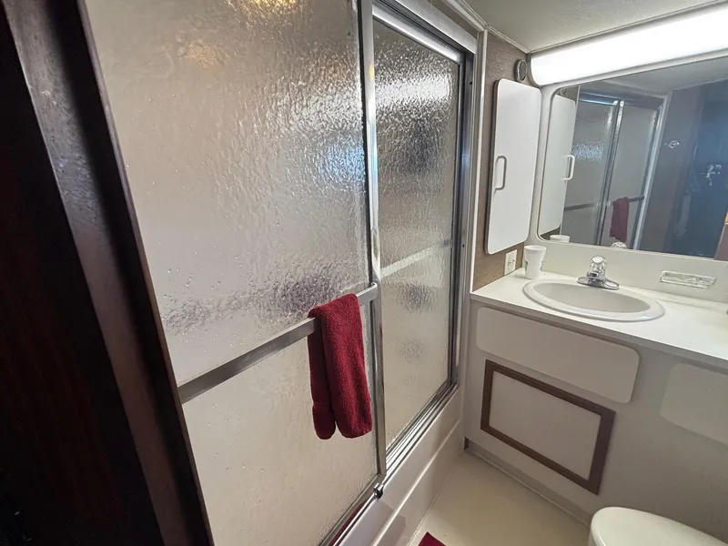 Slide: The Image of Bathroom interior of 1987 Hatteras Flybridge yacht with shower and sink. - 22