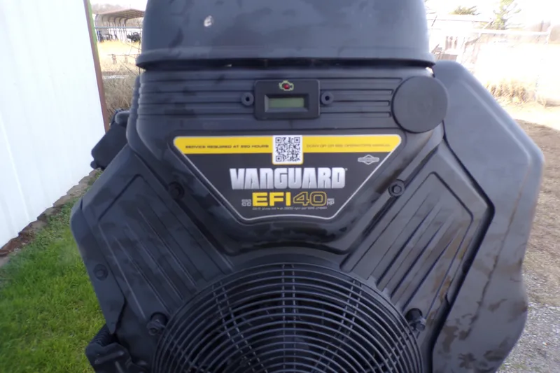 Slide: The Image of Vanguard EFI 40 engine on Xpress Bayou 180, 2026 model, outdoor setting. - 12