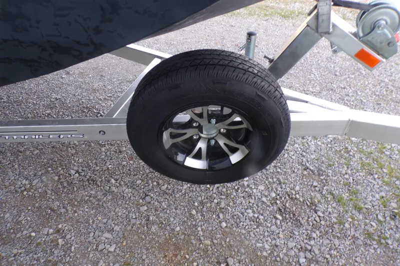 Slide: The Image of Trailer wheel of 2026 Xpress Bayou 180 on gravel surface. - 3