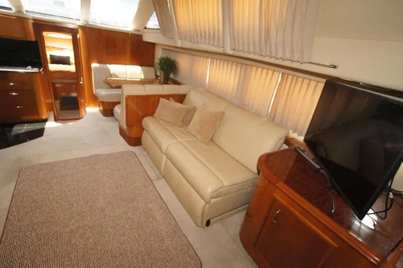 Slide: The Image of Luxurious interior of 2005 Carver 44 Cockpit Motor Yacht with plush seating and modern amenities. - 3