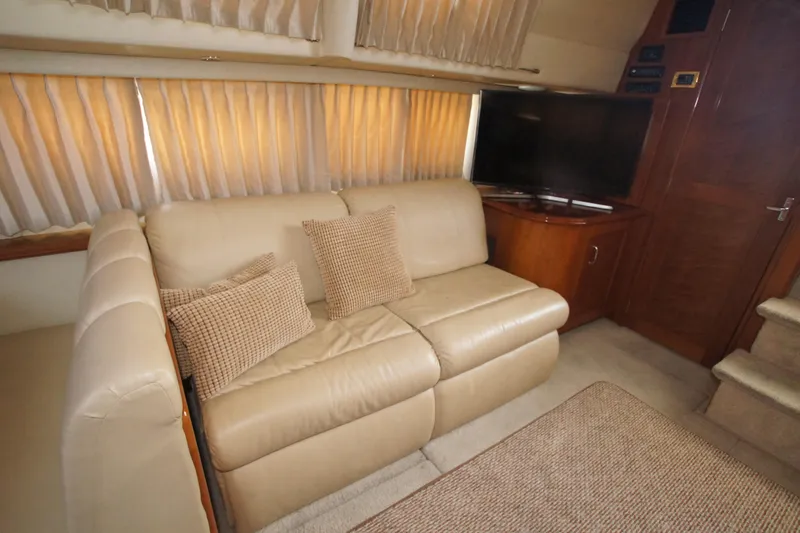 Slide: The Image of Luxurious interior of 2005 Carver 44 Cockpit Motor Yacht with beige leather sofa. - 7