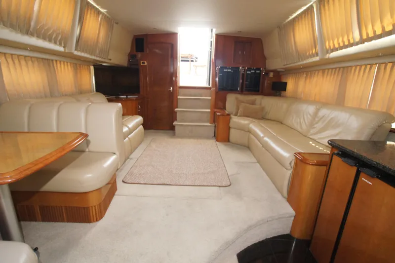 Slide: The Image of Luxurious interior of 2005 Carver 44 Cockpit Motor Yacht with plush seating and elegant decor. - 8